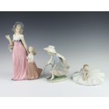 A Spanish figure of a lady with young girl 30cm (minor chips to flowers), a Nao figure of a seated