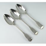 Three William IV silver fiddle and thread pattern table spoons with engraved monogram, London