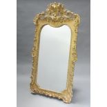A 19th Century shaped plate wall mirror contained in a decorative gilt frame 170cm h x 92cm w The