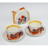 A Wedgwood Clarice Cliff crocus pattern "Tea for Two" teapot no.03709A and 2 ditto tea cups and