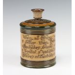 A Royal Doulton tobacco jar with verse 16cm There are minor chips to the lid and base and a hairline