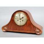 A 1930's Swiss 8 day chiming mantel clock with silvered dial and Arabic numerals contained in a