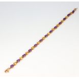 A yellow metal amethyst and gem set bracelet 6.7 grams, 18cm