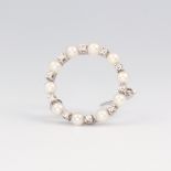 A white metal stamped 585 circular seed pearl and diamond brooch 18mm, 2.1 grams