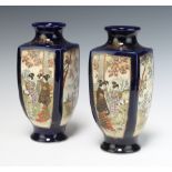 A pair of 1930's Satsuma blue ground baluster vases decorated with panels of figures and