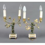 A pair of 19th Century gilt ormolu and bronze twin light candelabrum converted to table lamps,
