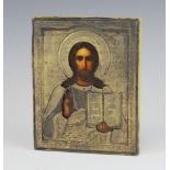 An 18th/19th Century Russian Orthodox icon, oil on panel, of Christ Pantocrator in a white metal