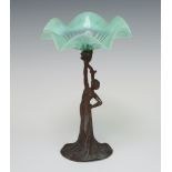 An Art Nouveau soft metal stand of a lady supporting a vaseline glass dish 21cm The base is corroded