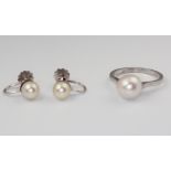 A white metal stamped 9ct cultured pearl ring, size O together with a pair of ditto ear clips, gross