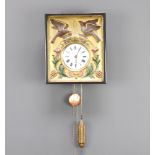 A 19th Century Continental wall clock with enamelled dial and Roman numerals contained in an