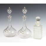 A pair of Edwardian decanters and stoppers with engraved fern decoration 32cm, with enamelled Sherry