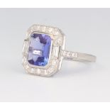 A white metal stamped Plat tanzanite and diamond ring, the emerald cut tanzanite 2.2ct, the