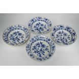 A matched set of 4 19th Century Meissen blue and white bowls decorated with fruits and flowers