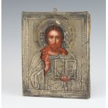 A 19th Century Russian Orthodox icon, oil on panel, of Christ The Pantocrator with an embossed and