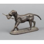 A 20th Century cast iron figure of a walking retriever with pheasant raised on an oval base 12cm h x