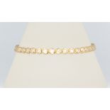 A yellow metal stamped 750 40 brilliant cut diamond bracelet, each approx. 0.05ct, total approx 2ct,