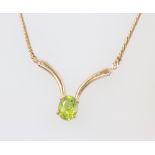 A 9ct yellow gold necklace set with an oval peridot 5.8 grams