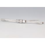 A white metal stamped 585 3 stone diamond brooch 0.25ct, 0.5ct, 0.25ct, 5.1 grams, 63mm, colour F/G,