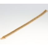 An 18ct yellow gold flat link bracelet 40.5 grams, 19.5cm in length
