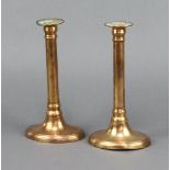 A pair of 19th Century Adam style copper candlesticks raised on oval bases 23cm h x 12cm w x 9cm