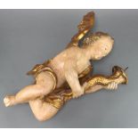 A 17th/18th Century carved and painted limewood candle sconce in the form of a putto 52cm h x 27cm w