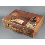 A Martin leather suitcase with brass mounts with LNER Harwich Hook of Holland Label Regina Hotel,