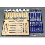 A quantity of ribbon and thread silver plated cutlery comprising 6 pairs of dessert eaters cased,
