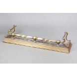 A Victorian brass railed fire curb with steel base 23cm h x 151cm x 30cmThe steel base has holes and