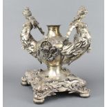 An impressive Victorian silver plated centrepiece, the 2 handles in the form of ladies raised on a