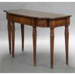 A Georgian style crossbanded mahogany side/serving table fitted a drawer, raised on turned and