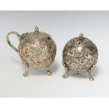 Two Indian repousse silver condiments decorated with flowers 92 grams
