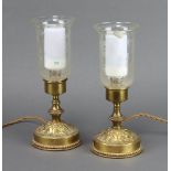 A pair of Rococo style gilt metal table lamps with etched glass shades and candle glow bulbs 27cm