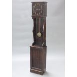 An Arts & Crafts style striking longcase clock, the 33cm rectangular dial with gilt Arabic