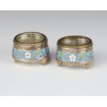 A pair of Russian silver and enamelled circular table salts stamped 910.MMET with blue, white and