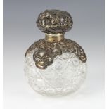 An Edwardian cut glass spherical scent with repousse silver mount Birmingham 1903, 14cm The top is