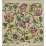 A Victorian woolwork embroidery of scrolling flowers and leaves 60cm x 52cm