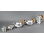 A Piquot ware 5 piece tea service comprising two tea pots, a lidded sugar bowl, sugar bowl and hot