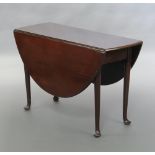 A Georgian mahogany oval drop flap dining table, raised on pad feet 70cm h x 110cm w x 40cm when