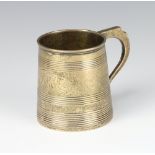 A George III silver mug of tapered form with reeded decoration and engraved monogram, London 1808,