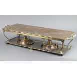 A rectangular copper and brass twin burner hot plate raised on bun feet 15cm h x 68cm w x 23cm