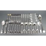 A quantity of silver plated lily pattern cutlery comprising 8 dessert spoons, a basting spoon, 6
