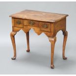 A Queen Anne style walnut side table fitted 3 drawers, raised on cabriole supports 69cm h x 76cm w x