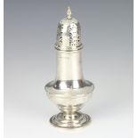 A silver Edwardian sugar shaker of Queen Anne design, 112 grams Birmingham 1910, 16cm, maker