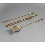 A brass 3 piece fireside companion set with poker, tongs and shovel