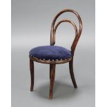 Thonet, a child's carved bentwood chair with upholstered seat raised on outswept supports 61cm h x