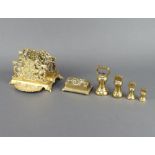 A pierced brass three section letter rack raised on bracket feet 9cm h x 13cm w x 15cm d, a