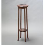 An Edwardian circular inlaid mahogany 2 tier jardiniere stand raised on outswept supports 99cm h x