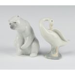 A Lladro figure of a seated Polar bear 13cm, ditto of a goose 10cm