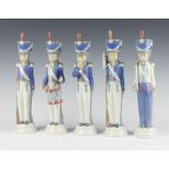 Five Lladro models of soldiers 30cm One is missing his drumsticks and three have stuck plumes