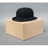 Bates of Jermyn Street, a gentleman's lightweight top hat, size 7 1/4 together with a Herbert